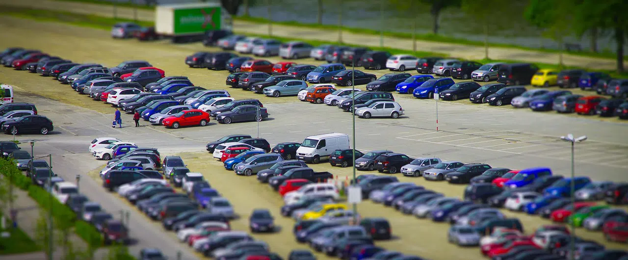 Large parking lot with green space